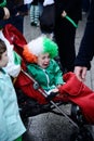 The child cried on the baby carriage St. Patrick`s Day ParadeÃÂ in Dublin, Ireland, March 18th 2015